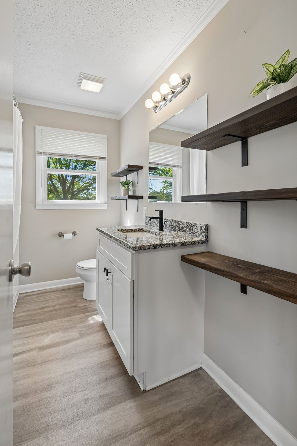 153 Old Lebanon Road Carthage, TN 37030 - Photo 18 of 29 a kitchen with stainless steel appliances granite countertop a sink cabinets and wooden floor
