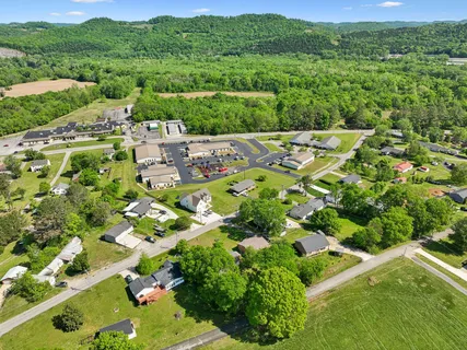 view of a city with green field