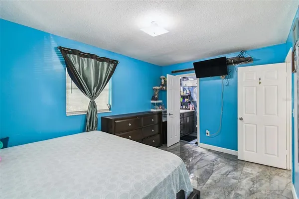 a bathroom with a sink toilet vanity tub and shower