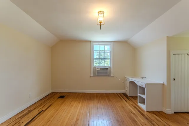 a view of a livingroom with wooden floor