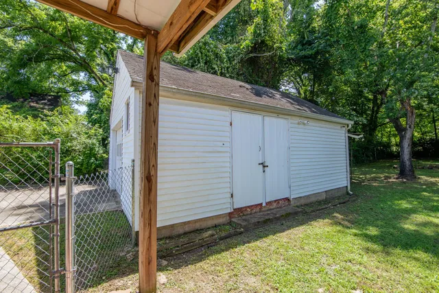 a view of a house with a backyard