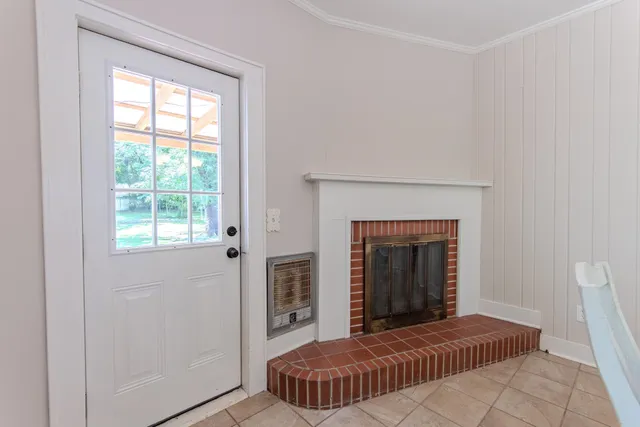 a kitchen with stainless steel appliances kitchen island granite countertop a refrigerator a sink dishwasher a stove and a refrigerator