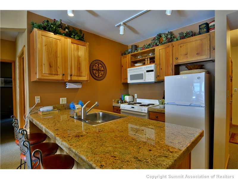 195 River Run Road, Unit 8043 Keystone, CO 80435 - Photo 2 of 25 Kitchen. Kitchen area with updated counter tops and bat seating.