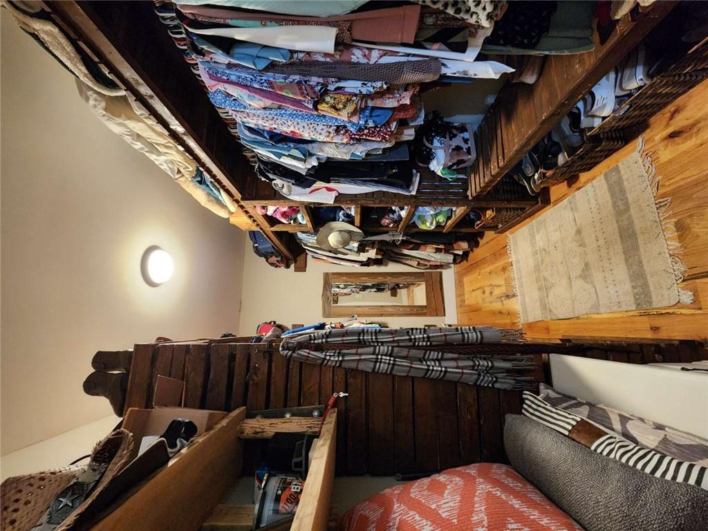 7350 Banks Mill Road Douglasville, GA 30135 - Photo 10 of 27 a view of walk in closet with clothes and shoes