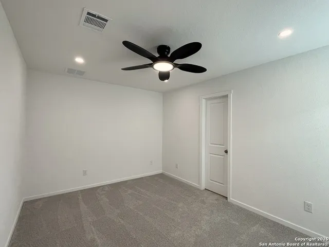 a view of a ceiling fan in a room