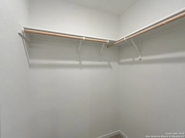 a view of an empty walk in closet