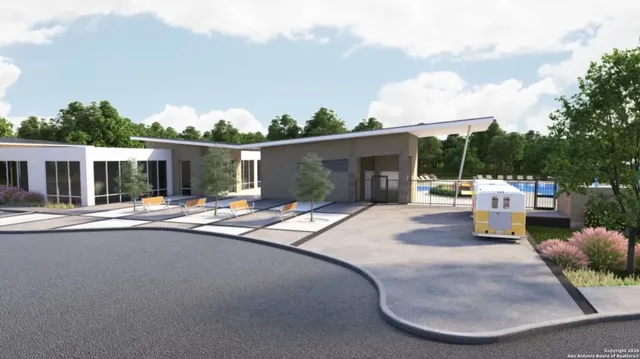 a view of a patio with a table and chairs and potted plants