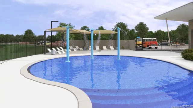 a swimming pool with outdoor seating and deck