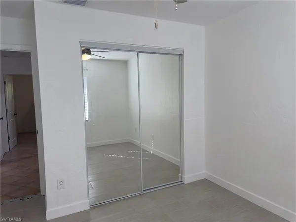 an empty room with a mirror