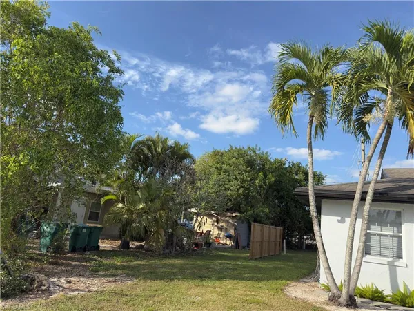 a view of house with swimming pool and sitting area