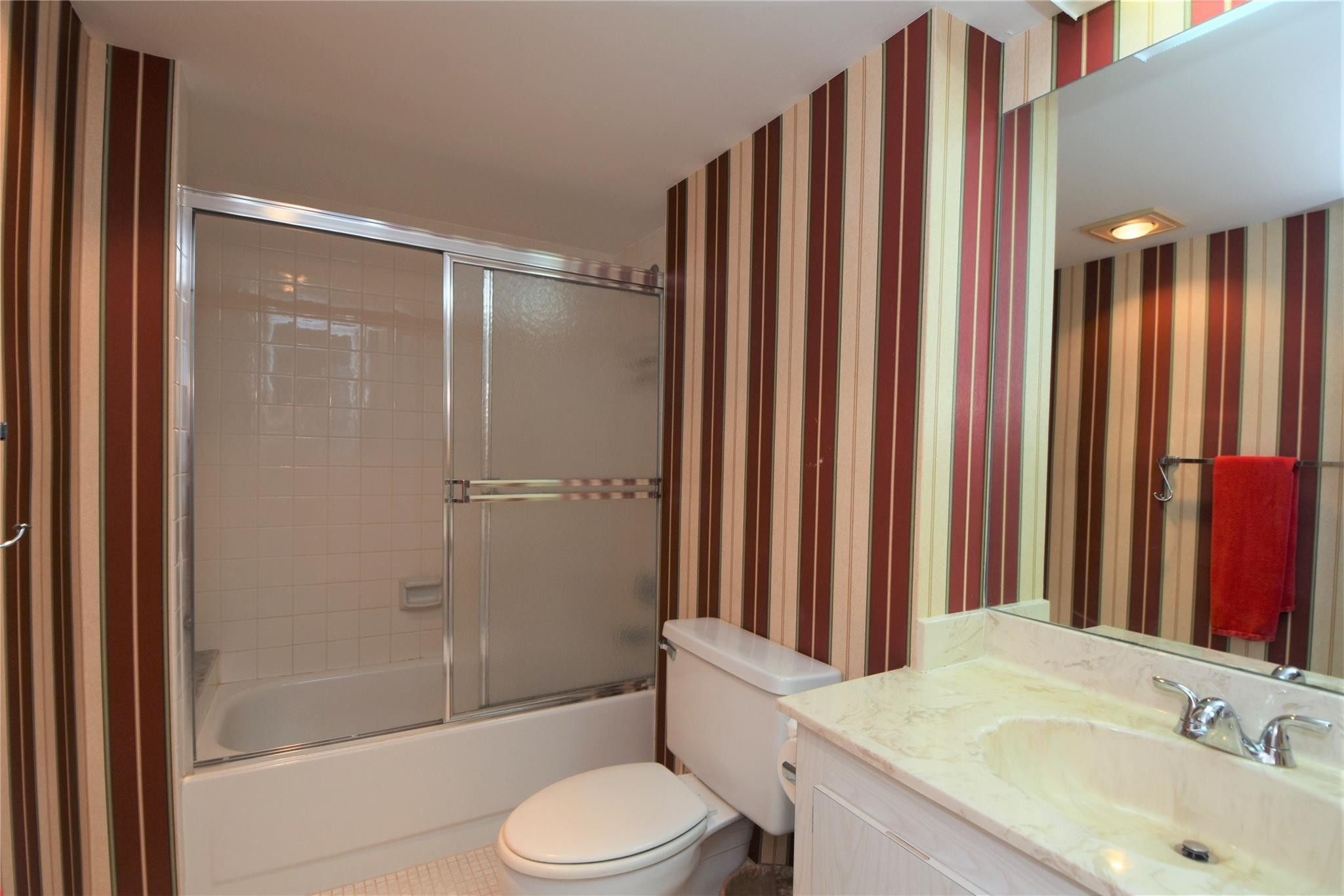 525 North Ocean Boulevard, Unit 522 Pompano Beach, FL 33062 - Photo 22 of 34 a bathroom with a sink toilet and shower