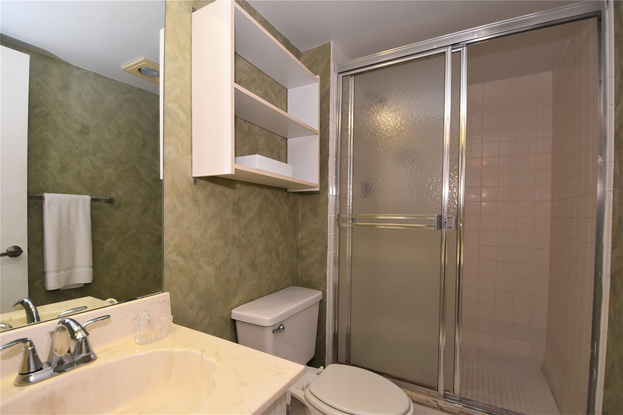 525 North Ocean Boulevard, Unit 522 Pompano Beach, FL 33062 - Photo 29 of 34 a bathroom with a sink toilet and shower