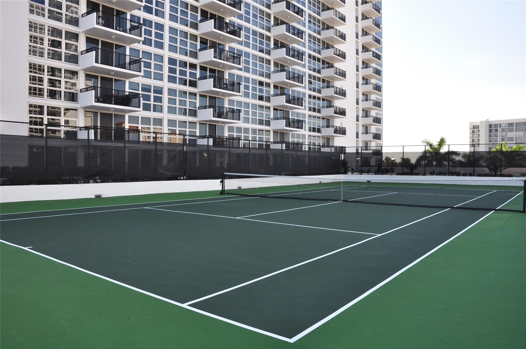 525 North Ocean Boulevard, Unit 522 Pompano Beach, FL 33062 - Photo 34 of 34 a view of a tennis court