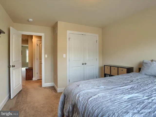 a bedroom with a bed and closet