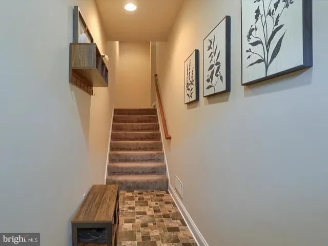 a view of a hallway with stairs