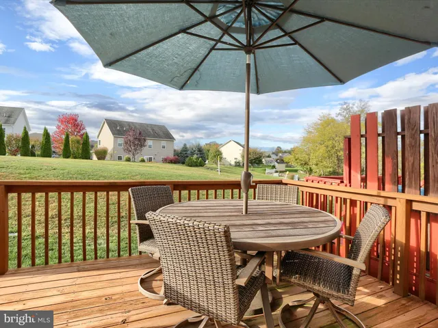 a balcony view with a seating space