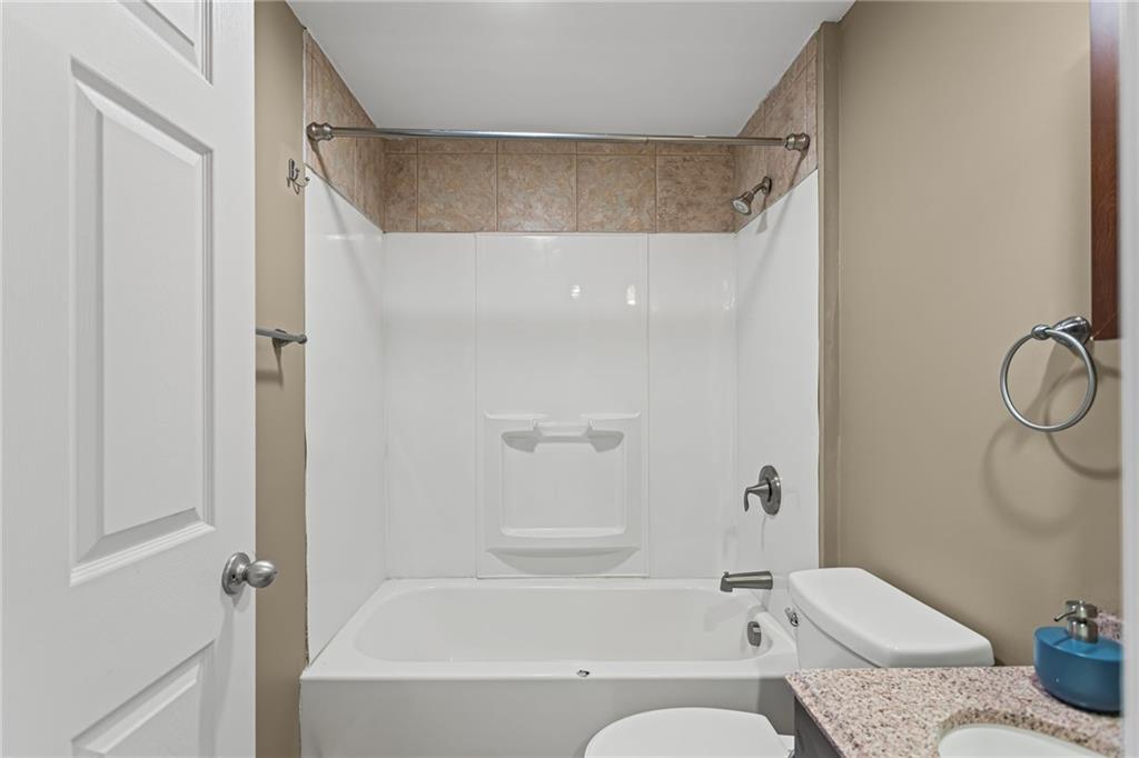 2815 Jane Street Pittsburgh, PA 15203 - Photo 31 of 42 a bathroom with a granite countertop bathtub shower and toilet
