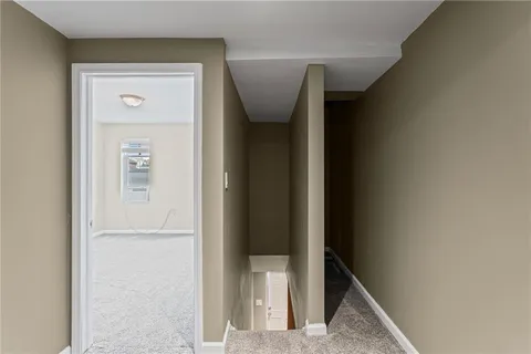 a view of hallway with stairs