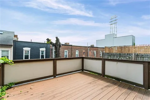 a view of a staircase with white walls and windows