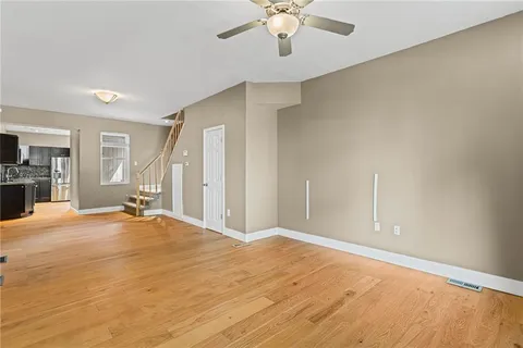a view of an empty room with a fireplace