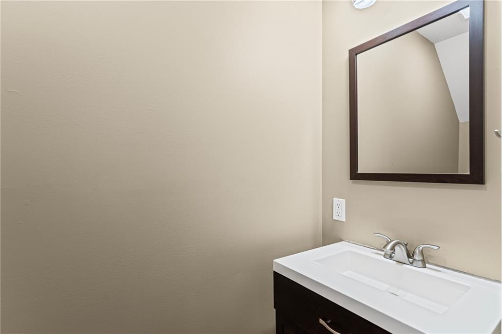 2815 Jane Street Pittsburgh, PA 15203 - Photo 8 of 42 a bathroom with a sink and a mirror