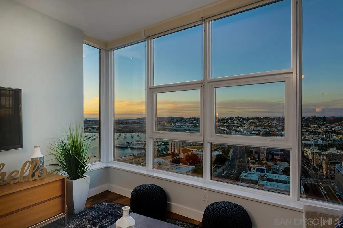 1325 Pacific Highway, Unit 2705 San Diego, CA 92101 - Photo 14 of 59 a room with balcony wooden floor and glass door