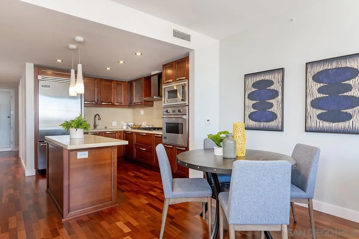 1325 Pacific Highway, Unit 2705 San Diego, CA 92101 - Photo 21 of 59 a view of kitchen with cabinets table and chairs
