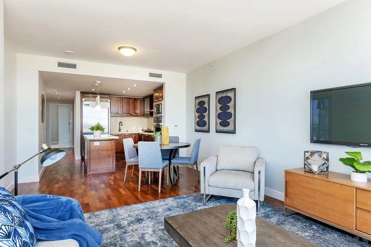 1325 Pacific Highway, Unit 2705 San Diego, CA 92101 - Photo 22 of 59 a living room with furniture wooden floor and a flat screen tv
