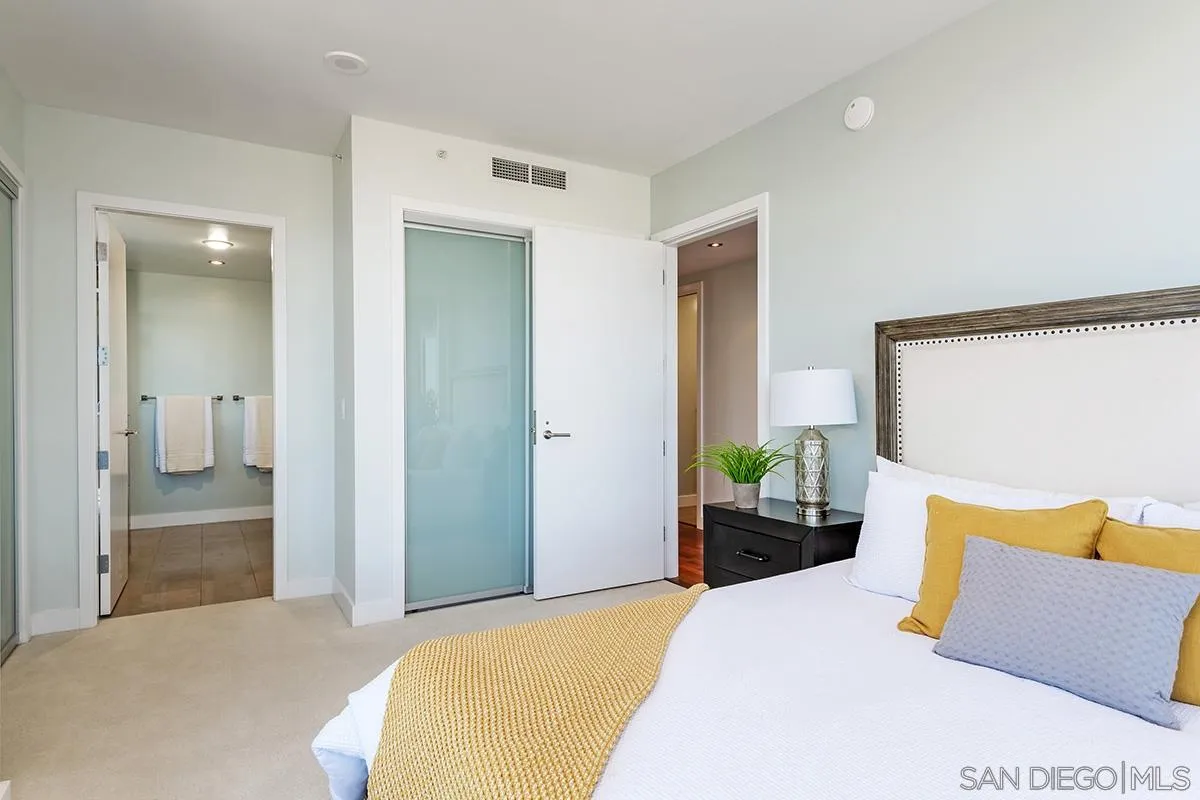 1325 Pacific Highway, Unit 2705 San Diego, CA 92101 - Photo 23 of 59 a bedroom with a bed and painted wall painting