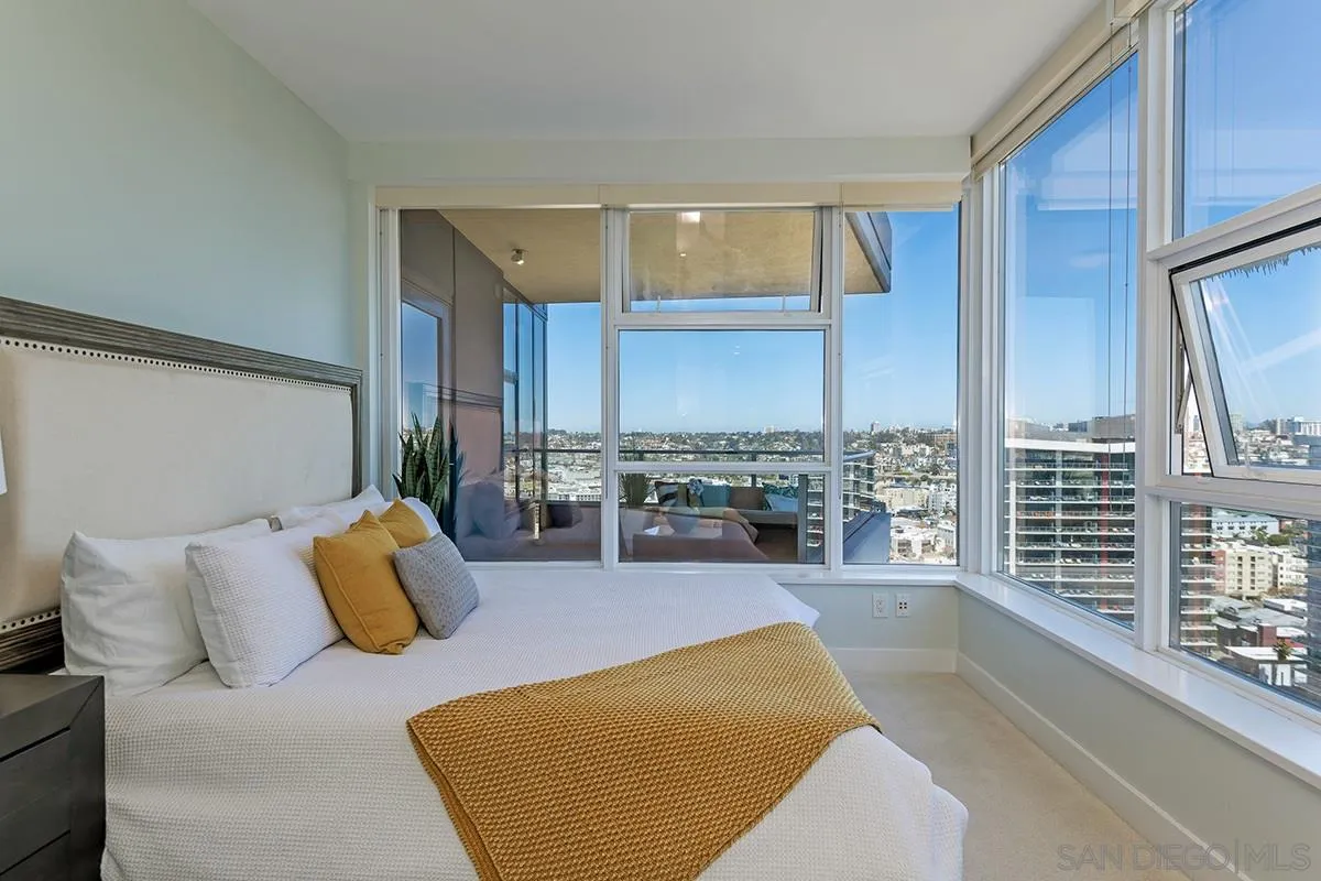 1325 Pacific Highway, Unit 2705 San Diego, CA 92101 - Photo 25 of 59 a living room with furniture and a floor to ceiling window