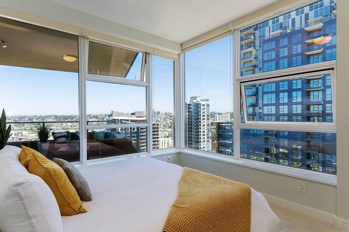1325 Pacific Highway, Unit 2705 San Diego, CA 92101 - Photo 26 of 59 a bedroom with furniture and next to a window