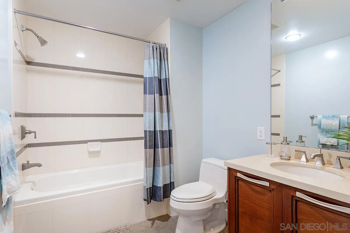 1325 Pacific Highway, Unit 2705 San Diego, CA 92101 - Photo 35 of 59 a bathroom with a sink toilet and shower