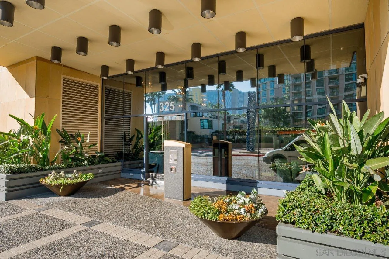 1325 Pacific Highway, Unit 2705 San Diego, CA 92101 - Photo 39 of 59 a backyard of a house with lots of green space and glass windows