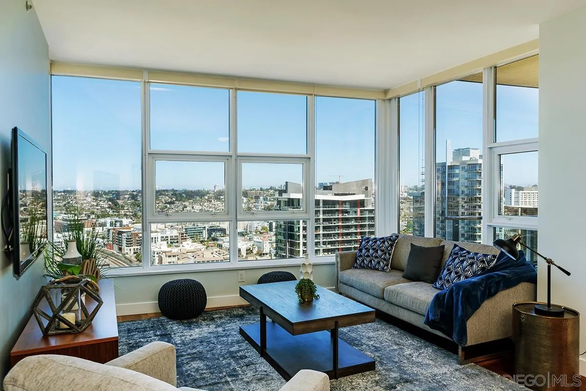 1325 Pacific Highway, Unit 2705 San Diego, CA 92101 - Photo 4 of 59 a living room with furniture and a floor to ceiling window