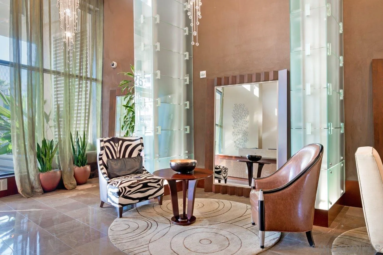 1325 Pacific Highway, Unit 2705 San Diego, CA 92101 - Photo 41 of 59 a living room with furniture and floor to ceiling windows