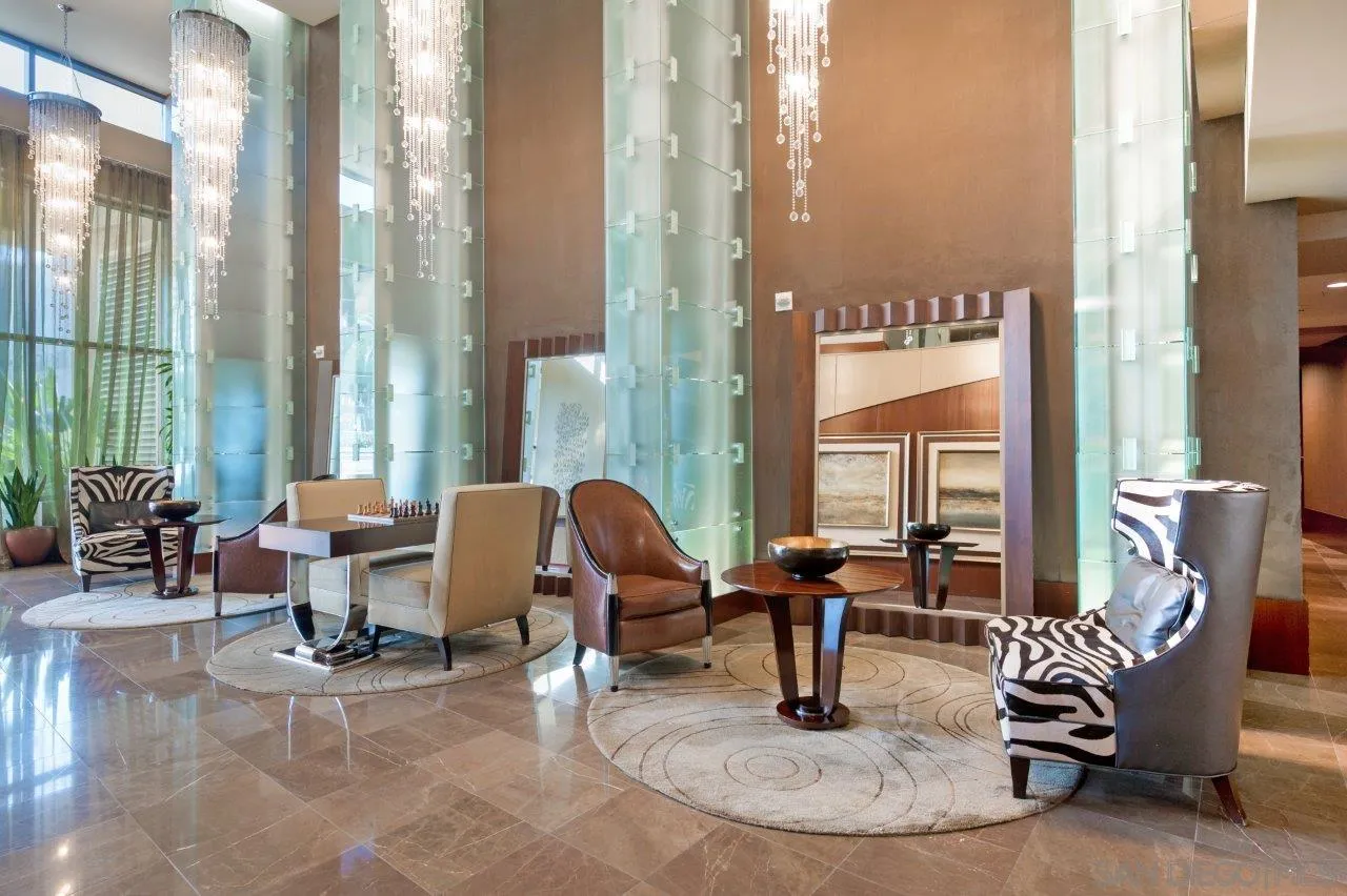 1325 Pacific Highway, Unit 2705 San Diego, CA 92101 - Photo 42 of 59 a view of a livingroom with furniture and floor to ceiling windows