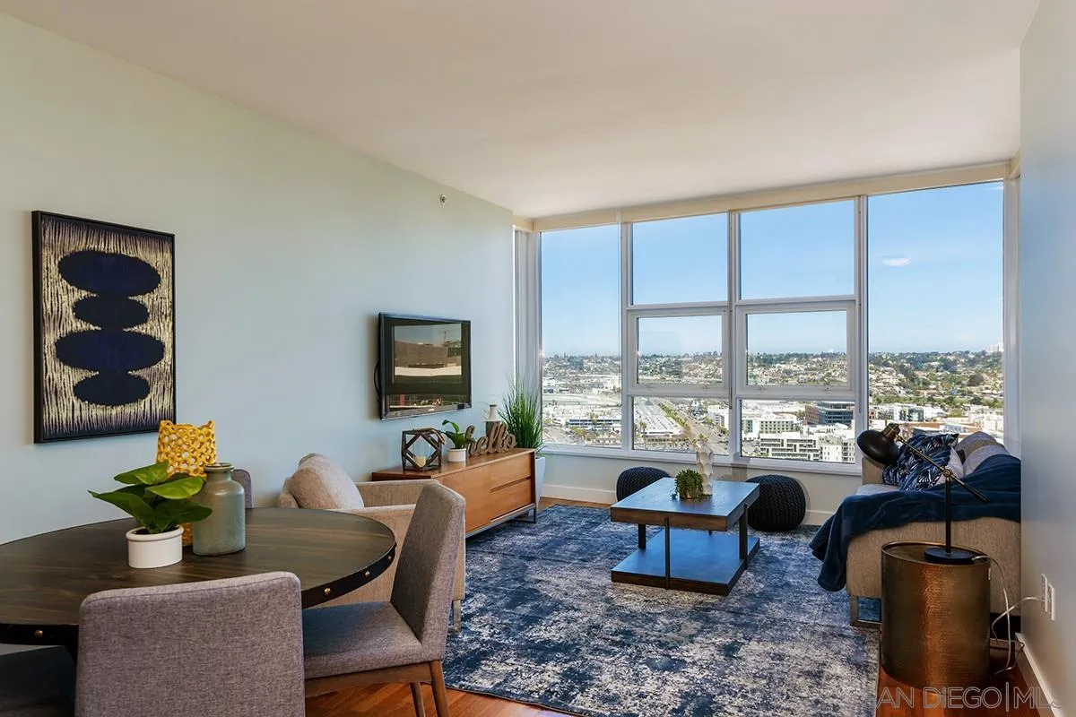 1325 Pacific Highway, Unit 2705 San Diego, CA 92101 - Photo 5 of 59 a living room with furniture and a floor to ceiling window