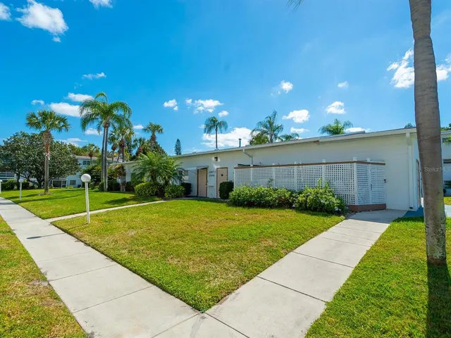 a room with lots of furniture and a large window