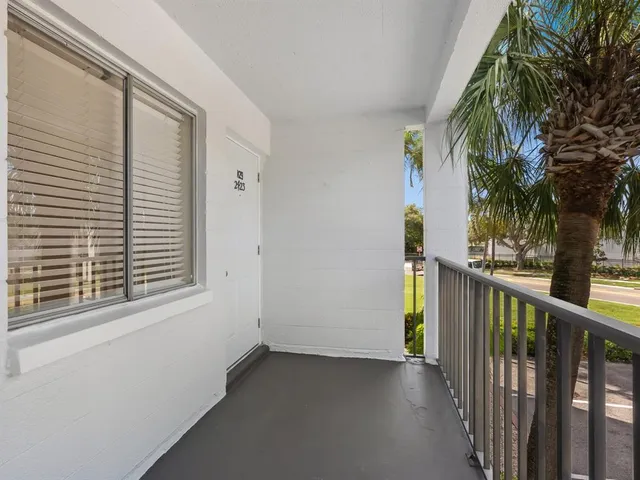 a view of a balcony with plants