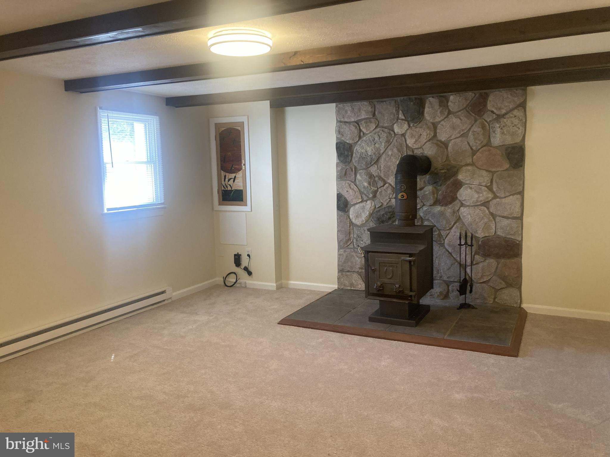 3624 Kemptown Church Road Monrovia, MD 21770 - Photo 58 of 80 Family room with woodstove