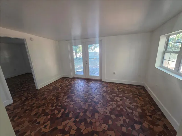 a view of an empty room and window