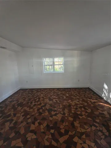 a view of an empty room and window