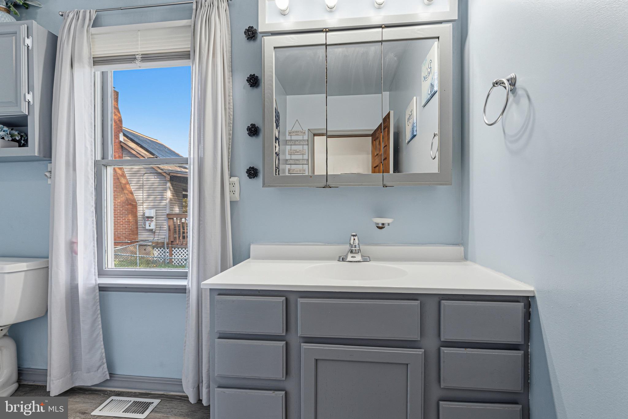 1907 Wills Road Baltimore, MD 21222 - Photo 17 of 42 a bathroom with a sink and a mirror