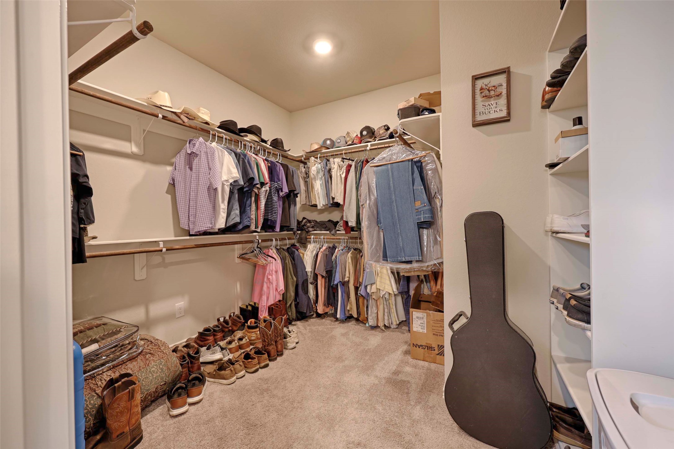 206 East Hinton Road Weimar, TX 78962 - Photo 12 of 22 a view of walk in closet with clothes and shoes