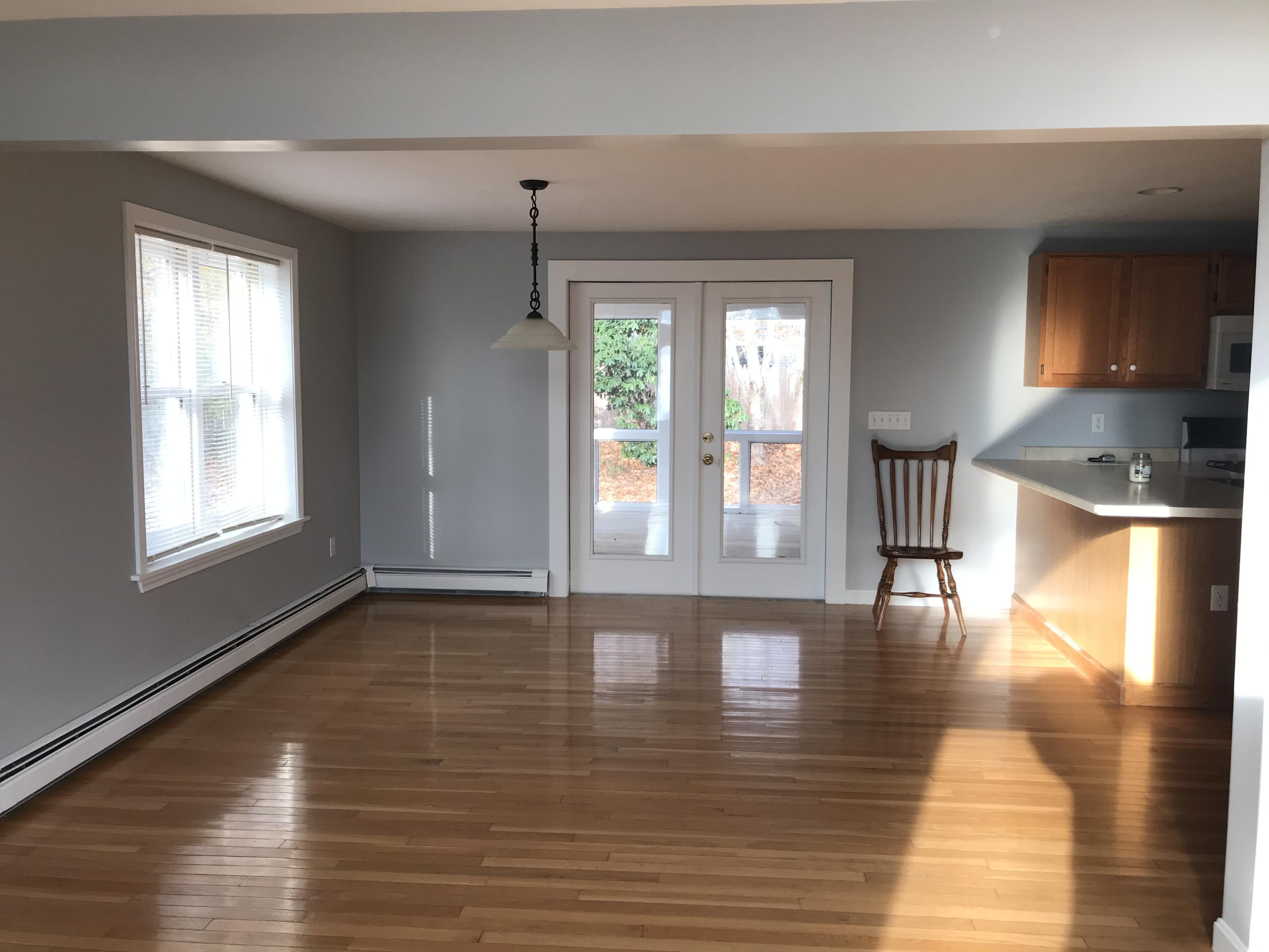 57 Deer Ridge Road Mashpee, MA 02649 - Photo 5 of 18 a view of empty room with wooden floor and fan