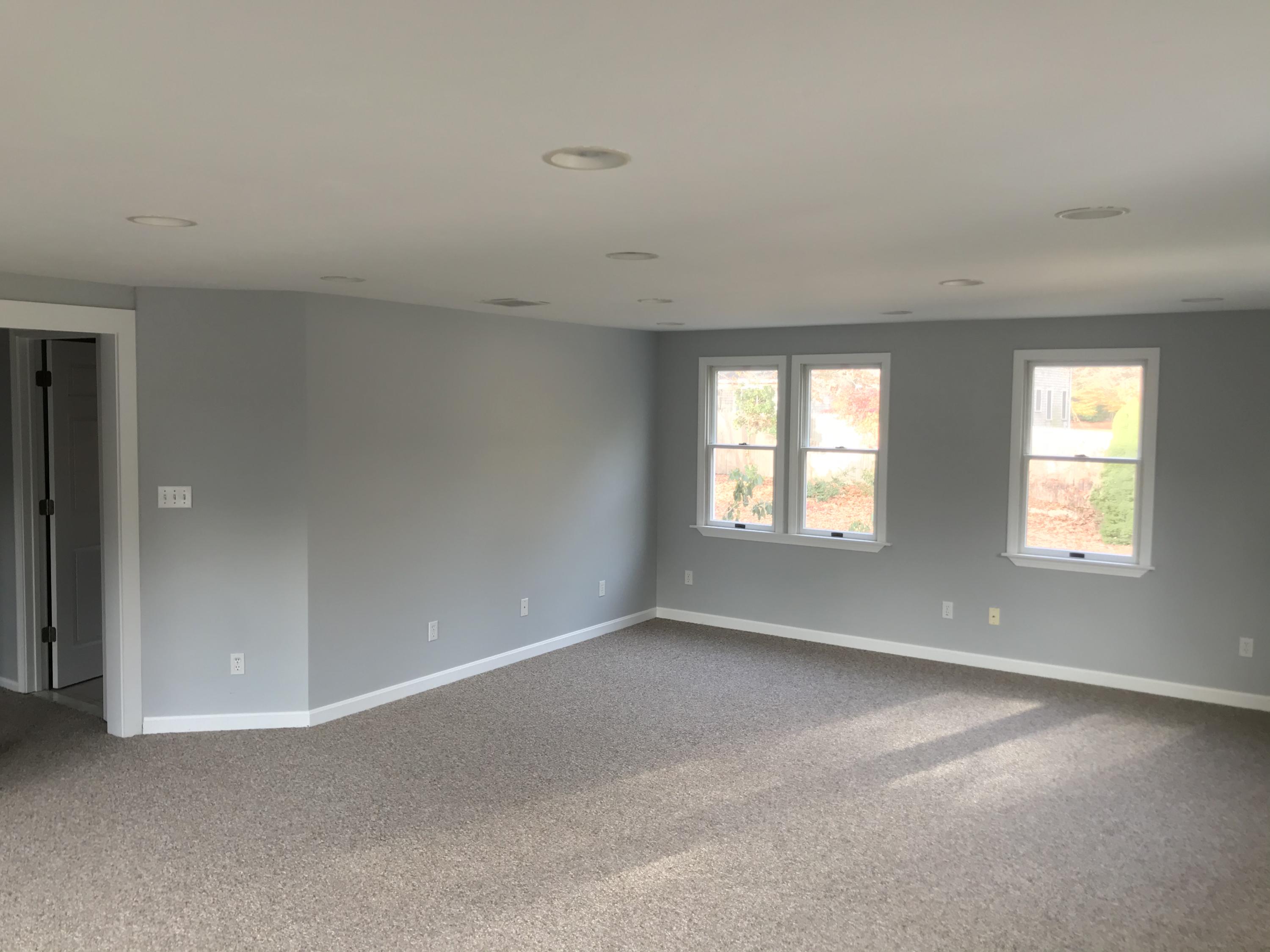 57 Deer Ridge Road Mashpee, MA 02649 - Photo 8 of 18 an empty room with windows