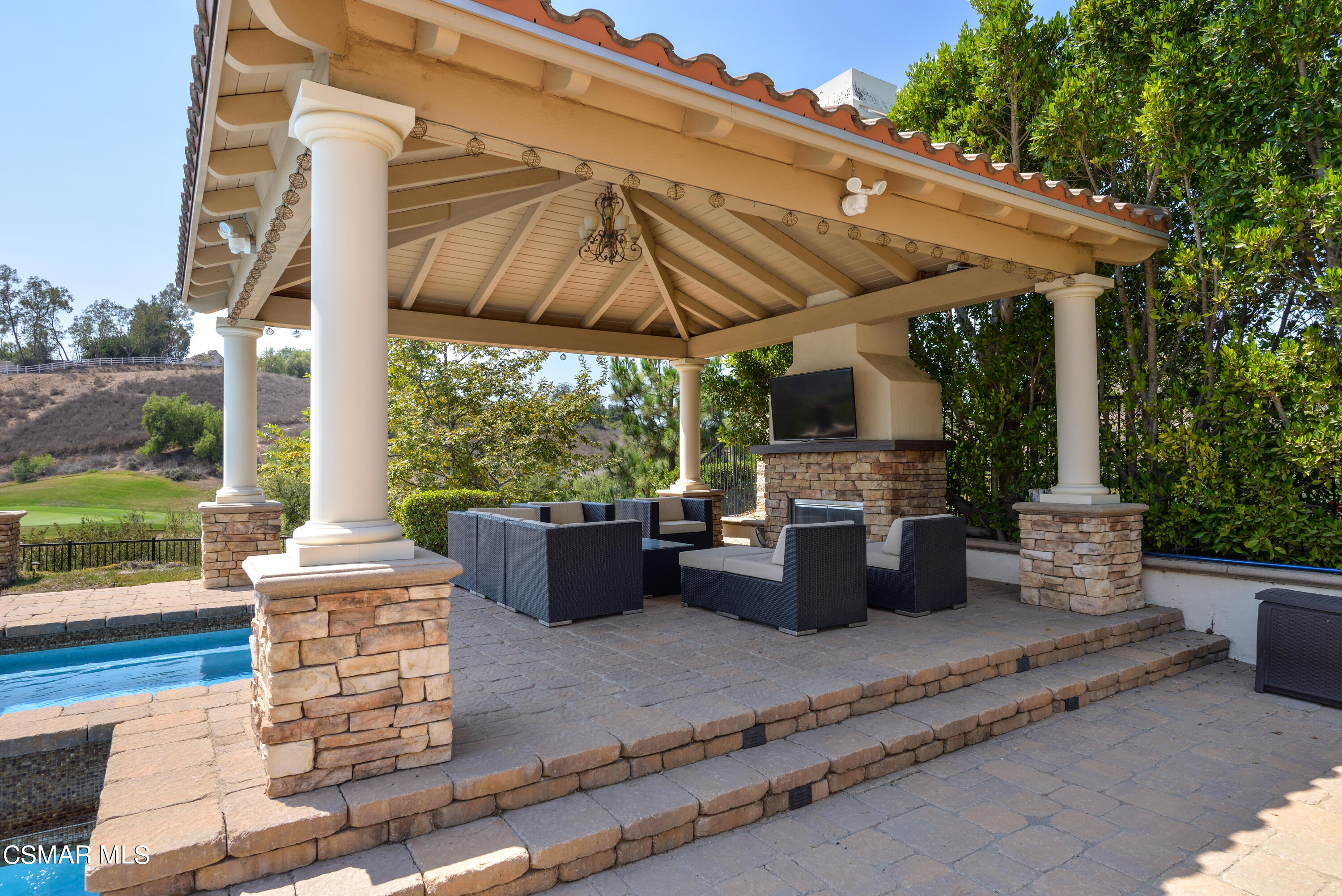 12442 Nelson Road Moorpark, CA 93021 - Photo 15 of 83 a view of a patio with couches chairs and a table and chairs