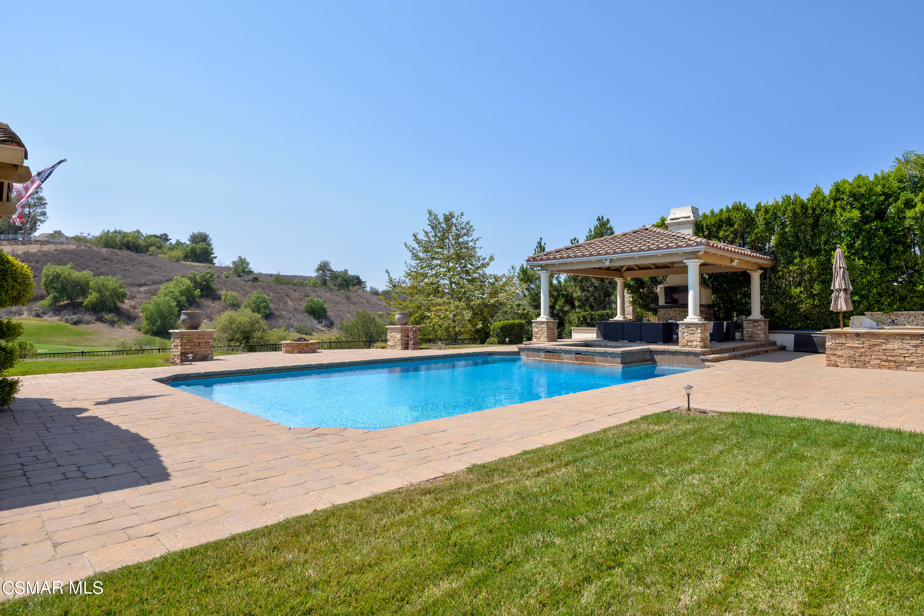 12442 Nelson Road Moorpark, CA 93021 - Photo 24 of 83 a view of swimming pool with seating area and trees in the background