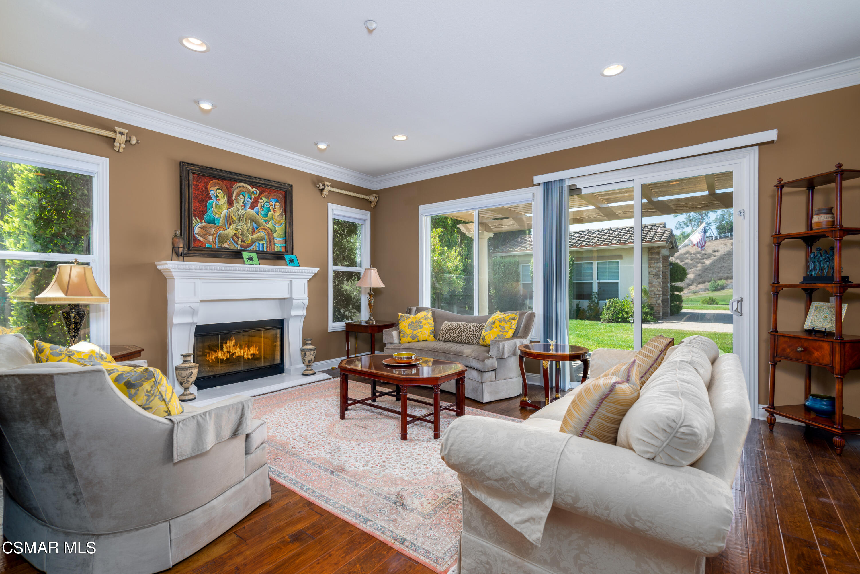 12442 Nelson Road Moorpark, CA 93021 - Photo 30 of 83 a living room with furniture a fireplace and a large window