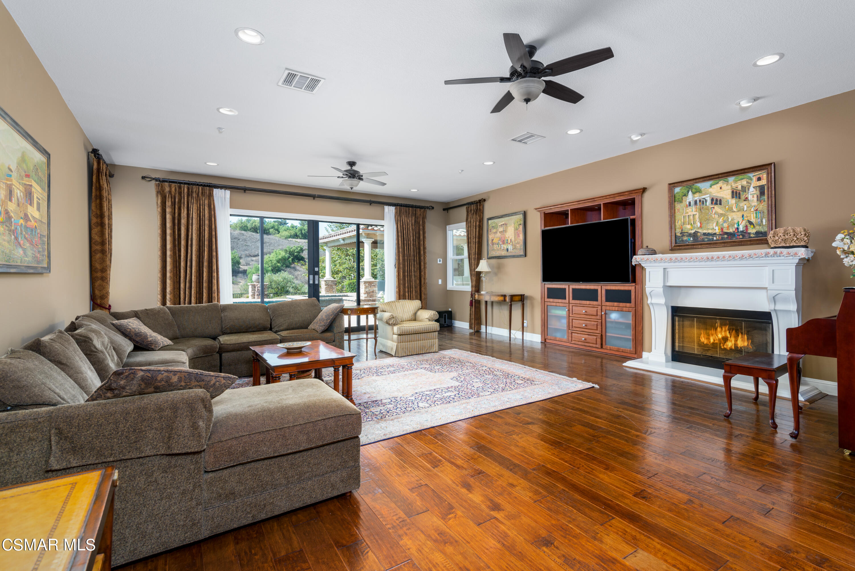 12442 Nelson Road Moorpark, CA 93021 - Photo 34 of 83 a living room with fireplace furniture and a flat screen tv